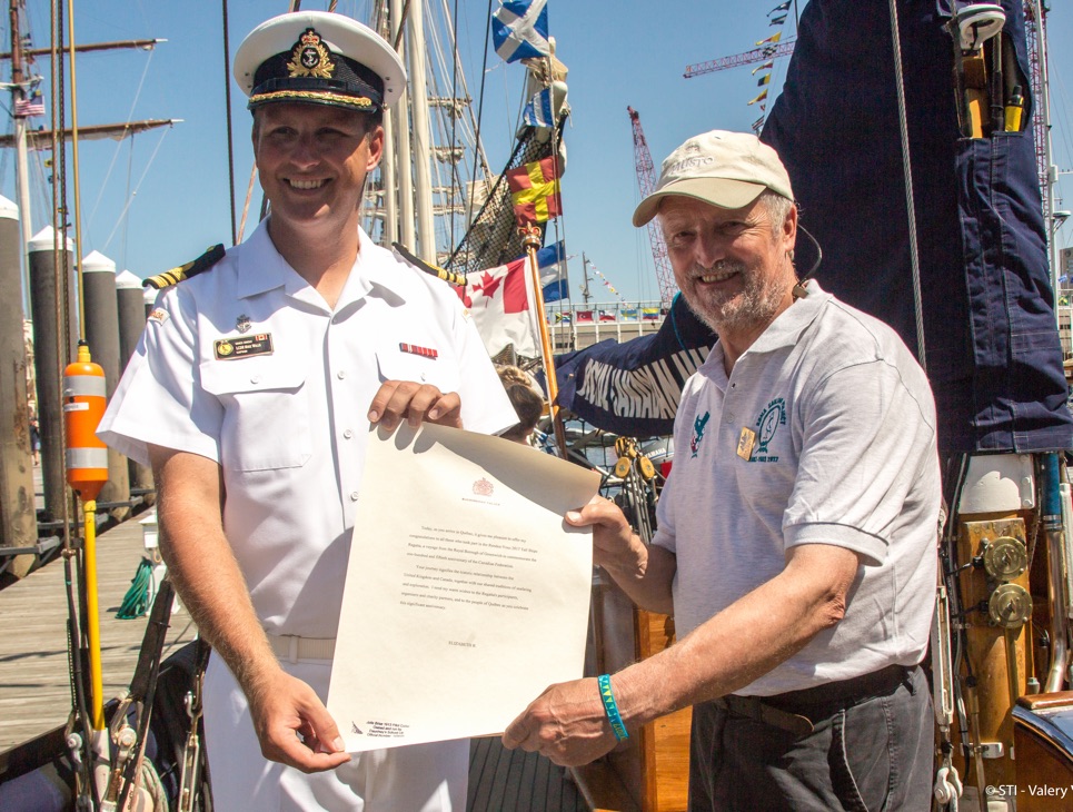 Captain Mike Willis of Oriole hands over the royal letter to Captain Andy Hunter of Rona ii