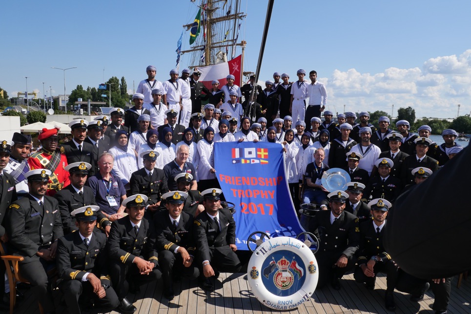 The crew of Shabab Oman II are presented with the Friendship Trophy in Szczecin.
